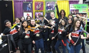Heather Gonzalez with Rockn' Stringz and Mark Wood at our booth at TMEA
